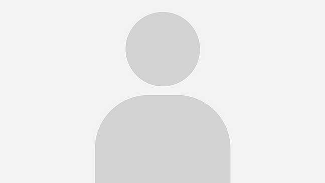 An abstract grey silhouette of an upper body against a light grey background.