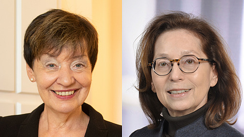 Two portraits of women side by side. On the left, a woman with short, dark hair and pearl earrings, wearing a black blazer. On the right, a woman with medium-length, brown hair and distinctive glasses, wearing a dark turtleneck and a gray jacket. Both are smiling at the camera.