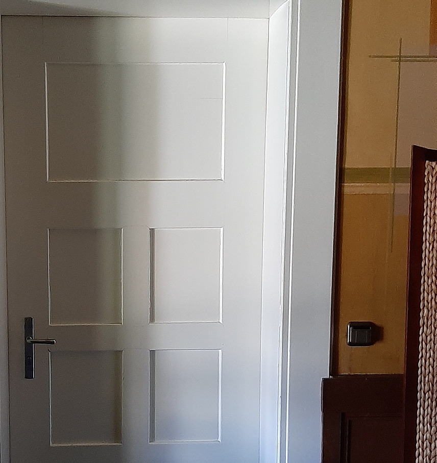 White wooden door of an apartment