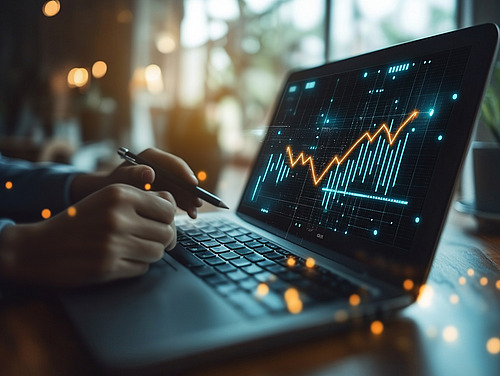 A notebook with a graphic and hands in front of it.