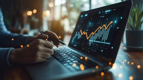 A notebook with a graphic and hands in front of it.