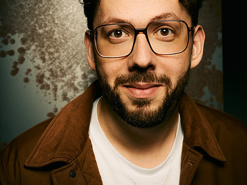 A man looks into the camera.