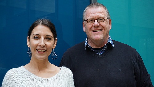 Kerstin Bartscherer and Achim Paululat smile at the camera