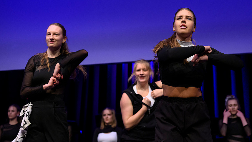 Close-up of several hip-hop dancers