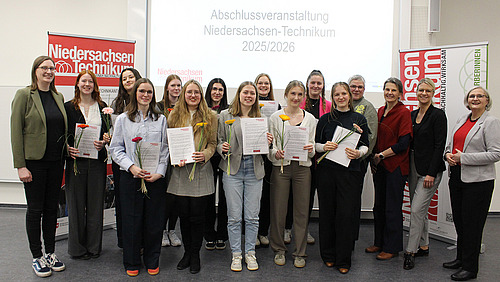 A group of people is smiling for a photo together.