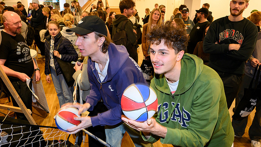 Two people with colorful balls in their hands