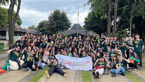 Group photo of conference attendees in uniform