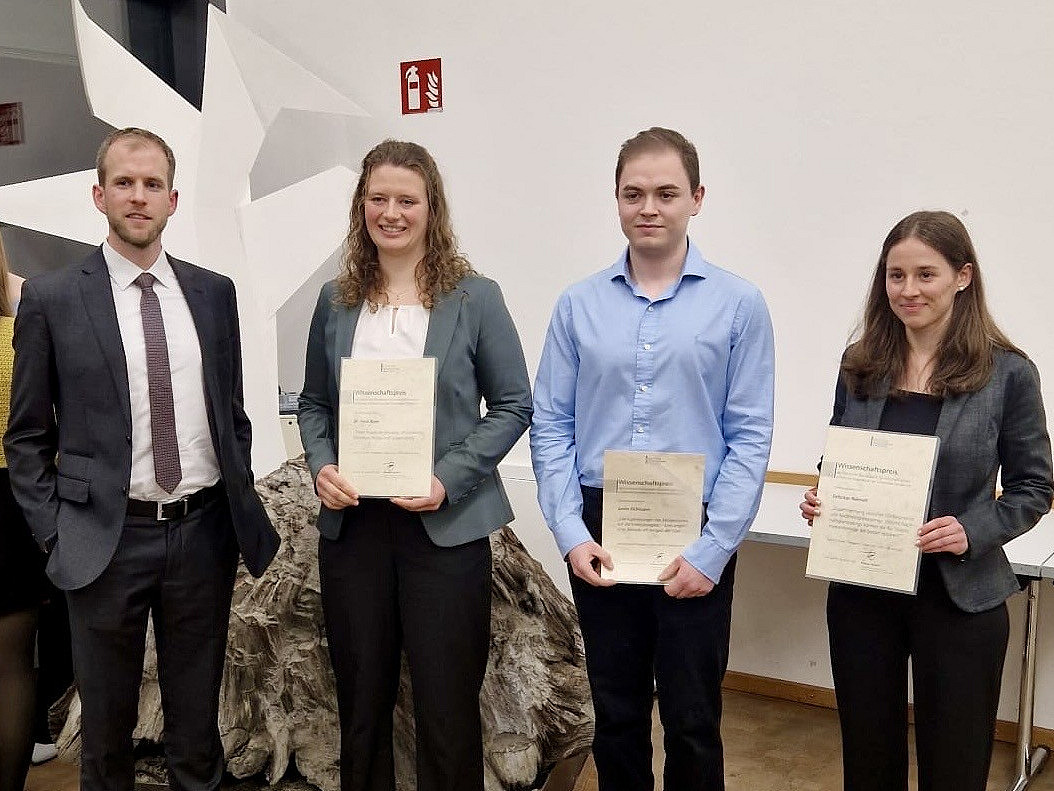 Prize winners with their awards for their theses