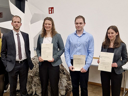 Prize winners with their awards for their theses