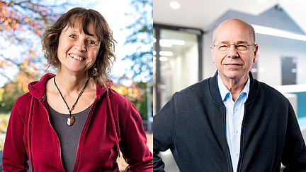 A woman and a man smile at the camera.