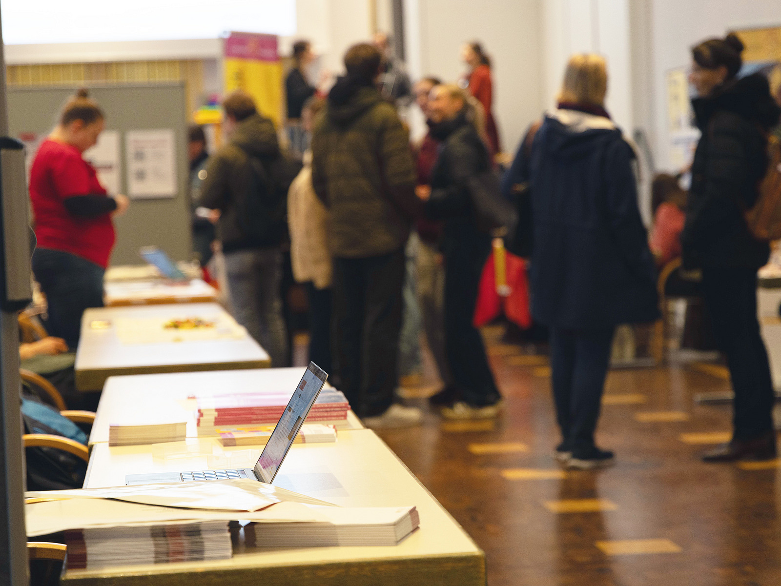 There are brochures and information material on tables. 