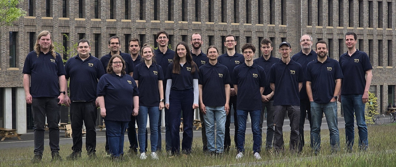 Distributed Systems Group member photo in front of the university's library Campus Westerberg.