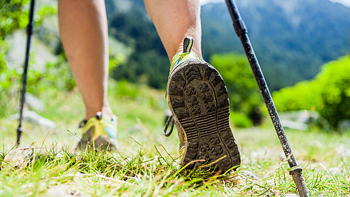 Close-up of the feet of a person walking