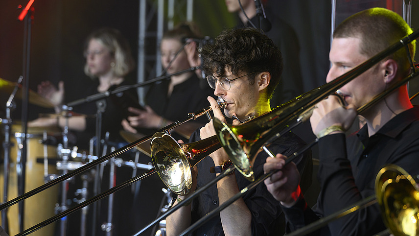 Several brass players on one stage