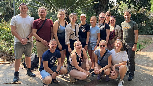 A group of people smiling