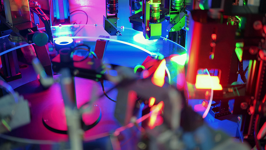 high-tech automated assembly line with colorful sensors and robotics in electronic component production  robotics, automation, sensor technology, and high-tech industry.