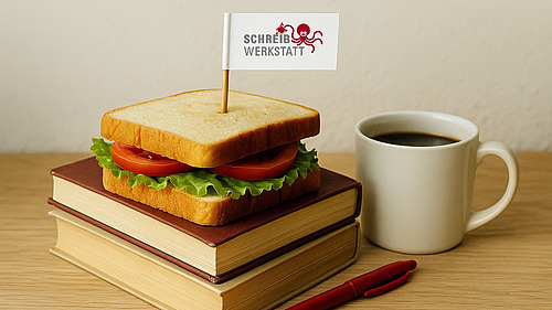 A sandwich lies on a pile of books, with a flag stuck in it that says “Writing Center,” and next to it is a cup of coffee.