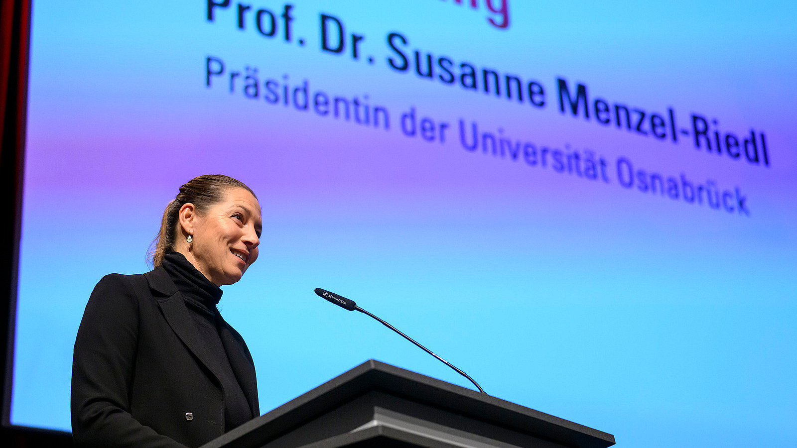 Close-up of university president Prof. Susanne Menzel-Riedl giving a speech