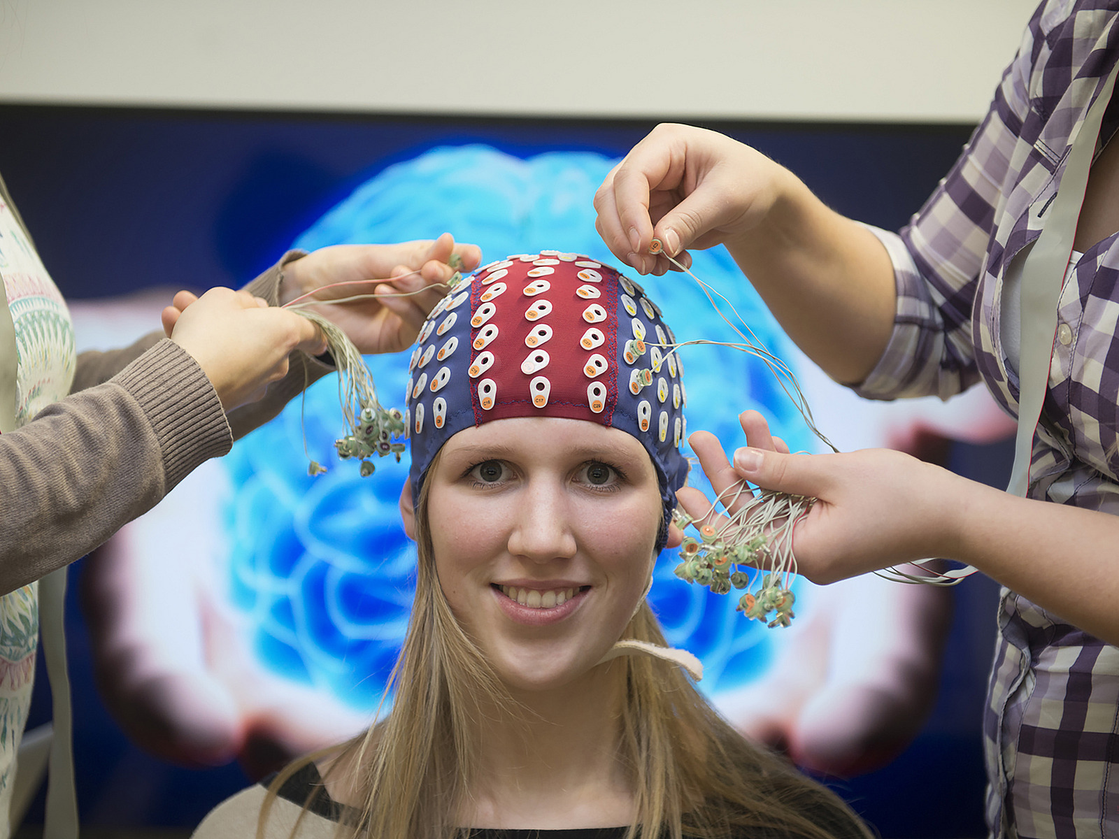 One person with electrode cap.