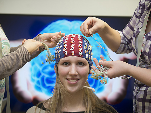 One person with electrode cap.