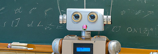 Robot in front of blackboard