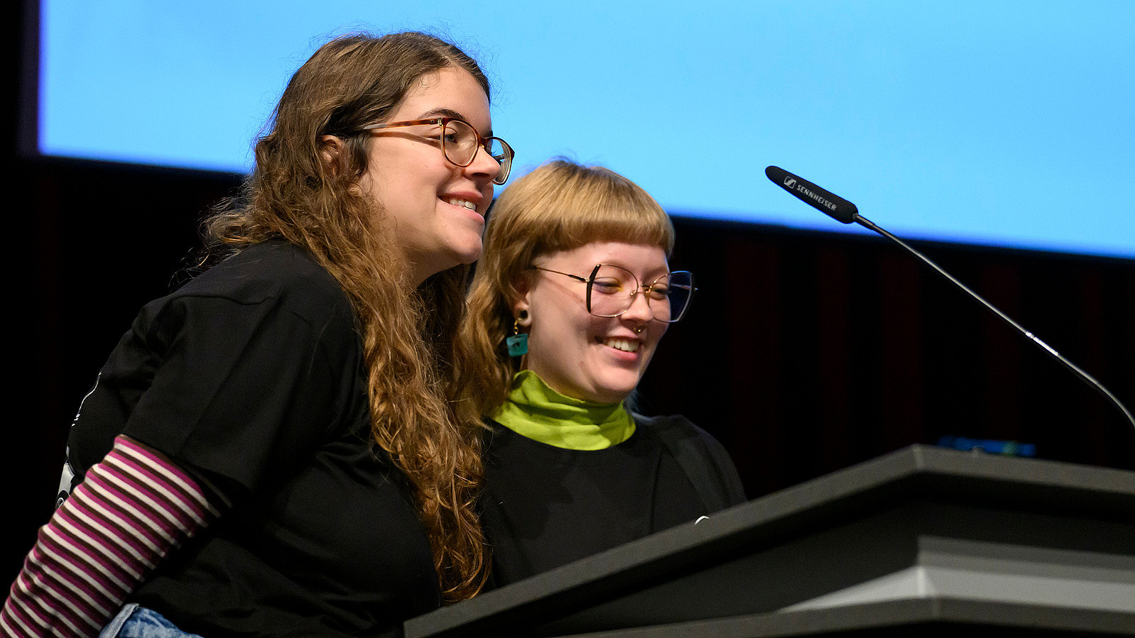 Close-up of two women at a lectern