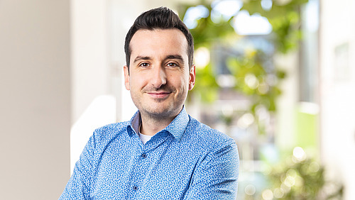 A man looks into the camera.