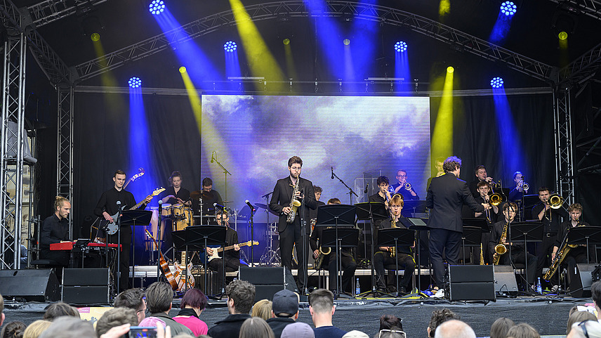 Several musicians on one big stage