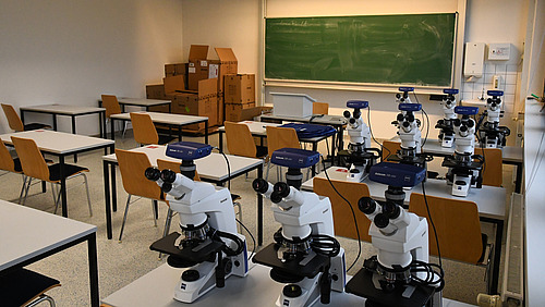 Tables with microscopes on them
