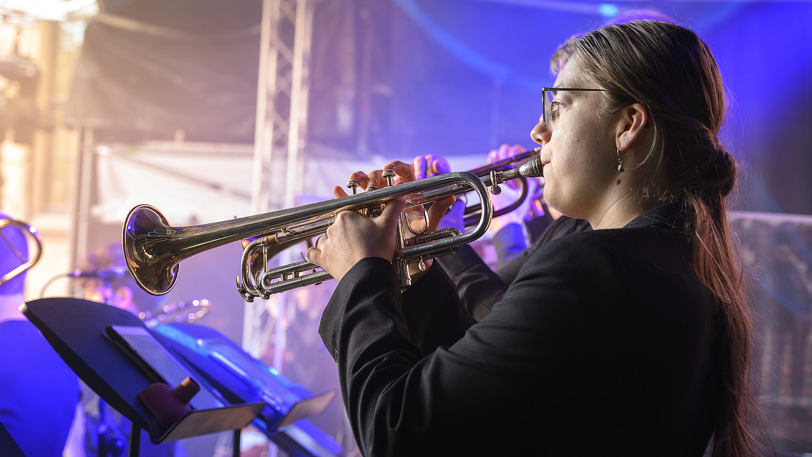 A brass player on a stage